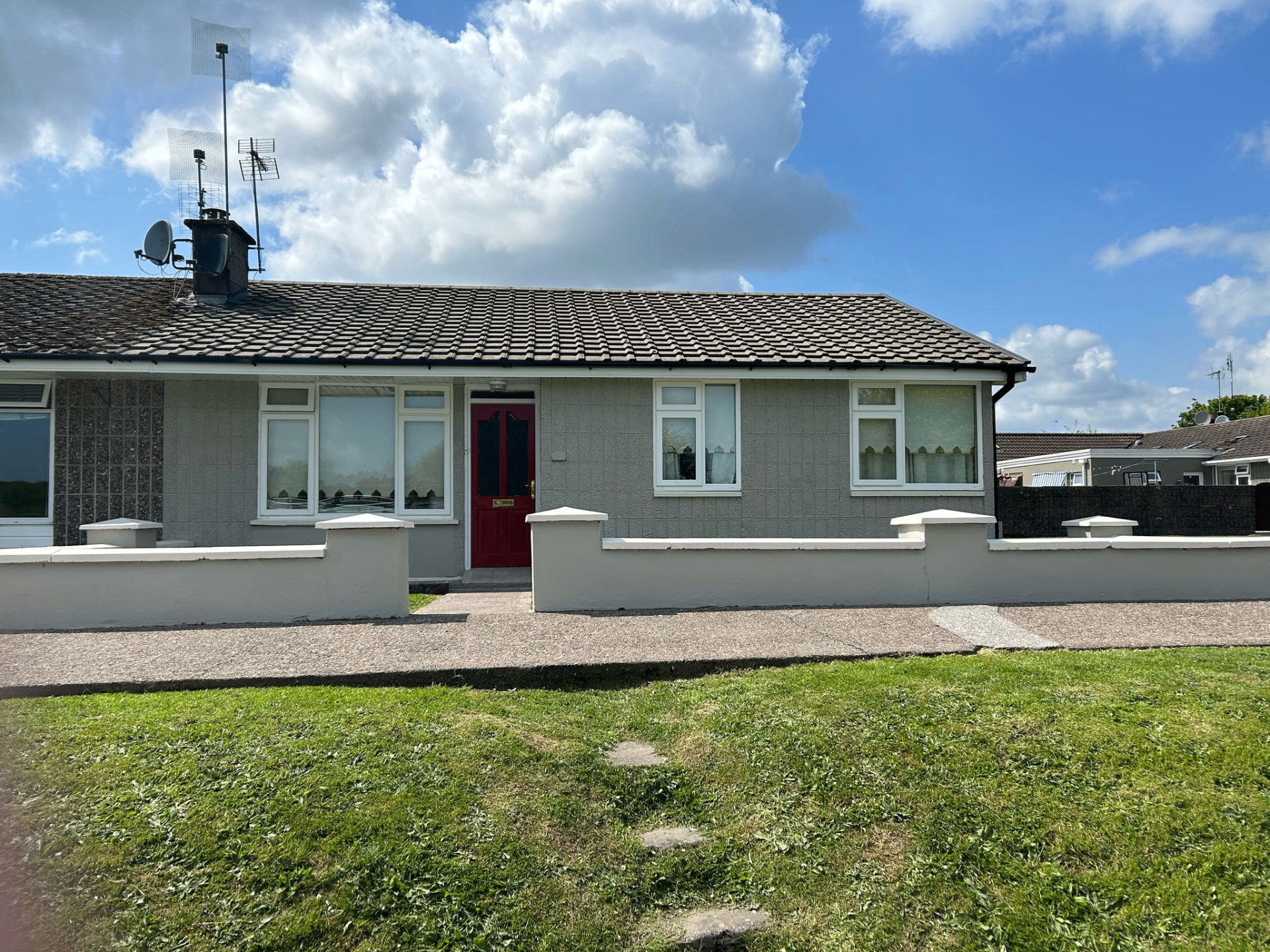 Front elevation of a house after exterior works were completed