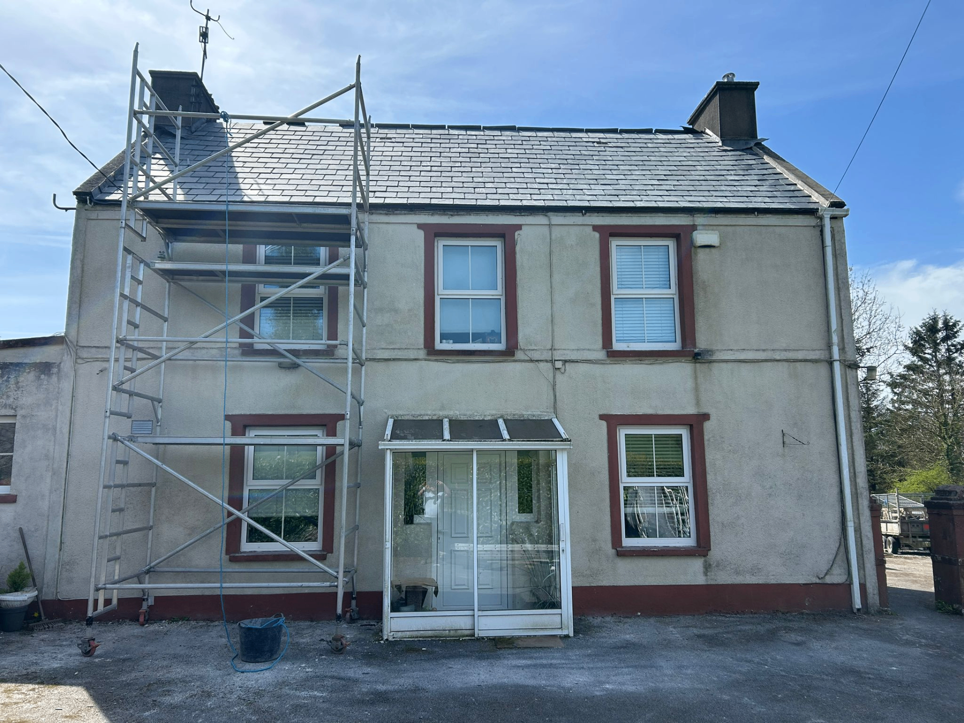 Finished slate roof replacement on the front of a house
